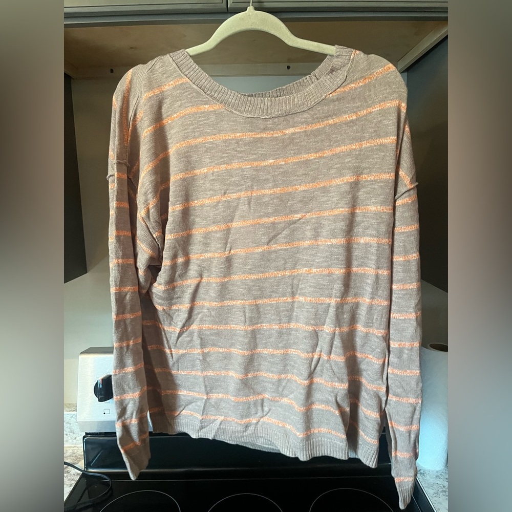 Brown and coral sweater.